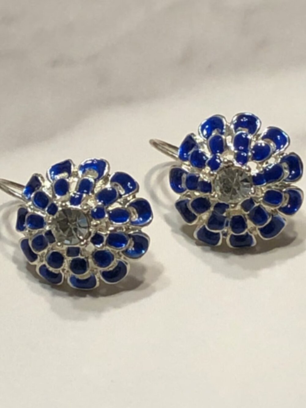 Rhinestone & blue enamel silvertone earrings